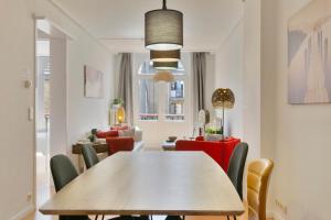 a dining room with a table and chairs at Villa Olga in Blankenberge