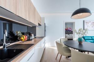 a kitchen with a table and a dining room at Villa Vega in Dubrovnik