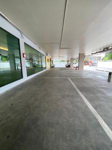 an empty parking lot in an empty parking garage at CK2 Hotel SHA EXTRA PLUS in Bangkok