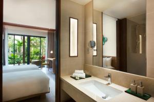 Ein Bett oder Betten in einem Zimmer der Unterkunft Dusit Princess Moonrise Beach Resort