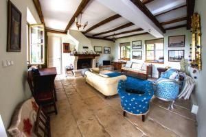 a living room with a couch and a fireplace at Villa Bazjaki - Beautiful stone villa in Istria with private pool in Livade