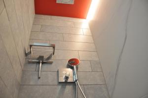 an overhead view of a floor with a chair and a table at B&B Bella en Basiel in Bruges
