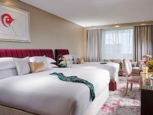 Cama o camas de una habitación en The g Hotel