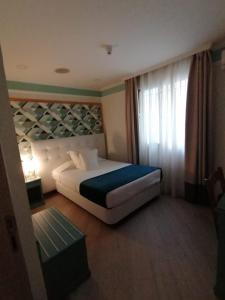 Posteľ alebo postele v izbe v ubytovaní Hotel Doña Blanca