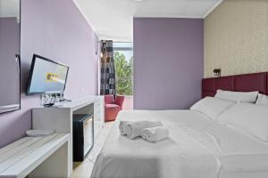 Postel nebo postele na pokoji v ubytování Hotel Relax + 37 fotografií