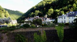 a small village with houses and a mountain at The Lyn Valley Guest House in Lynmouth