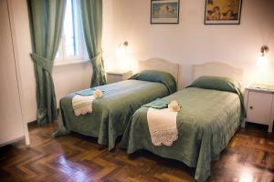 Postel nebo postele na pokoji v ubytování Bed and Breakfast Nonna Loreta