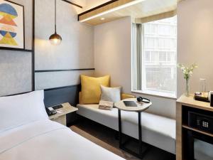 Ibis Samarinda客房内的一张或多张床位