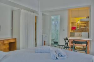 Posteľ alebo postele v izbe v ubytovaní Islanders Yard Apartments