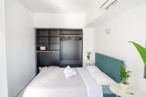Posteľ alebo postele v izbe v ubytovaní Islanders Yard Apartments