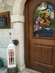 a door with a lantern in front of a house at Dolci Vecchi Ricordi in Valpolicella in Negrar