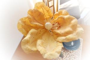 a close up of a flower on a table at Apartments Brnic in Baška