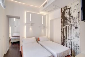A bed or beds in a room at Albergo Abruzzi