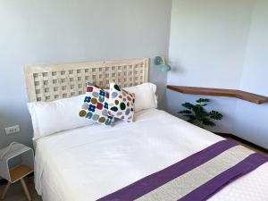 Voodi või voodid majutusasutuse Kenting Sunhow Inn toas