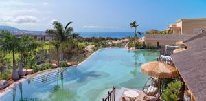 a swimming pool with a view of the ocean at Royal River, Luxury Hotel - Adults Only in Adeje