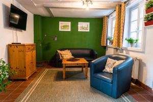 Χώρος καθιστικού στο Fachwerkhotel - Ferienhäuser Vorhof zur Hölle