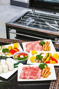a group of plates of food on a grill at HOTEL KARUIZAWA CROSS in Karuizawa +86 photos