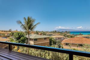 a view of the ocean from the balcony of a house at Kahana Villa E610 in Kahana