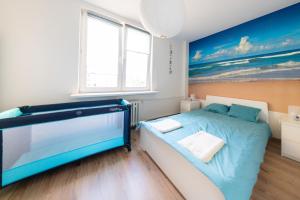 Posteľ alebo postele v izbe v ubytovaní Apartament Blue Sea Gdynia