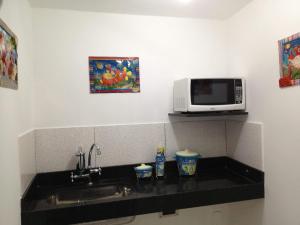A cozinha ou cozinha compacta de Hotel Casa Blanca Porto Seguro