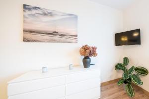 Televízia a/alebo spoločenská miestnosť v ubytovaní Apartament Blue Sea Gdynia