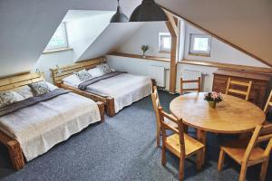 Postel nebo postele na pokoji v ubytování Apartmány Na Faře