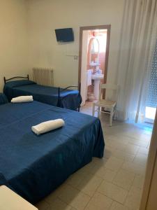Ένα ή περισσότερα κρεβάτια σε δωμάτιο στο Hotel Piada D'Oro