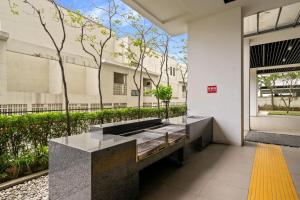 a bathroom with a large window in a building at Puchong Setiawalk Residence By Iconique Espace in Puchong