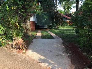 a walkway leading to a house with a sidewalk at Zorzal 1 in Puerto Rico