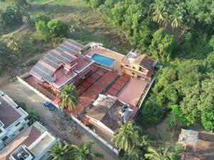 an overhead view of a house with a swimming pool at Cliff Heaven in Colva