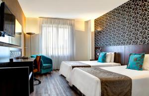 Postel nebo postele na pokoji v ubytování Quality Hotel Curitiba