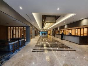 a hallway of a building with a person walking down it at Hotel Intercontinental Cali, an IHG Hotel in Cali