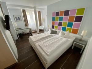 Postel nebo postele na pokoji v ubytování Altstadt Hotel Baunachshof
