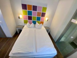Postel nebo postele na pokoji v ubytování Altstadt Hotel Baunachshof