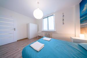 Posteľ alebo postele v izbe v ubytovaní Apartament Blue Sea Gdynia