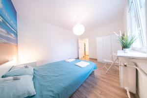 Posteľ alebo postele v izbe v ubytovaní Apartament Blue Sea Gdynia