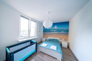 Posteľ alebo postele v izbe v ubytovaní Apartament Blue Sea Gdynia