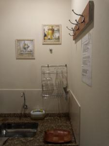 a bathroom with a sink and a sink at Chalés JARDIM-REAL in Lumiar