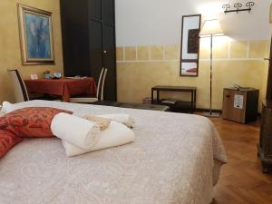 a bedroom with a bed with two pillows on it at Cittadella in Verona