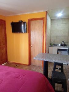 Kuchyň nebo kuchyňský kout v ubytování Habitaciones y Apartamentos el Caleuche El Tabo