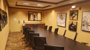 a conference room with a long table and chairs at Holiday Inn Express & Suites Paducah West by IHG in Paducah