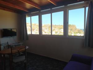 A television and/or entertainment centre at apartamentos la villa 2