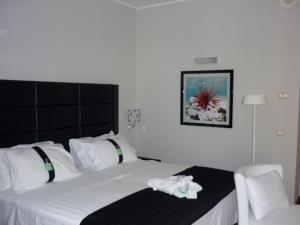 Uma cama ou camas num quarto em Holiday Inn Genoa City by IHG