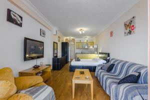 A television and/or entertainment centre at Orlando very nice apartment by AltamarHomes