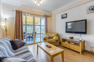 A television and/or entertainment centre at Orlando very nice apartment by AltamarHomes