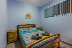 A bed or beds in a room at Orlando very nice apartment by AltamarHomes