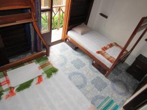 Postel nebo postele na pokoji v ubytování Esperanto Bed & Breakfast Surf Hostel