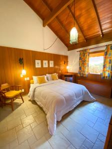 Voodi või voodid majutusasutuse Pousada O Cantinho da Raposa toas