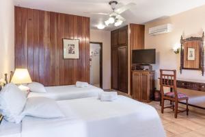Paramanta Lifestyle Hotel tesisinde bir odada yatak veya yataklar