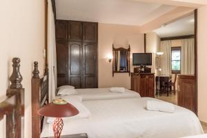 Paramanta Lifestyle Hotel tesisinde bir odada yatak veya yataklar